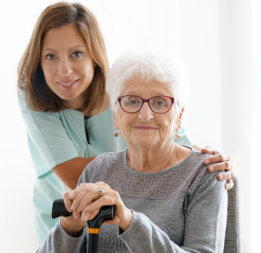 caregiver and senior smiling